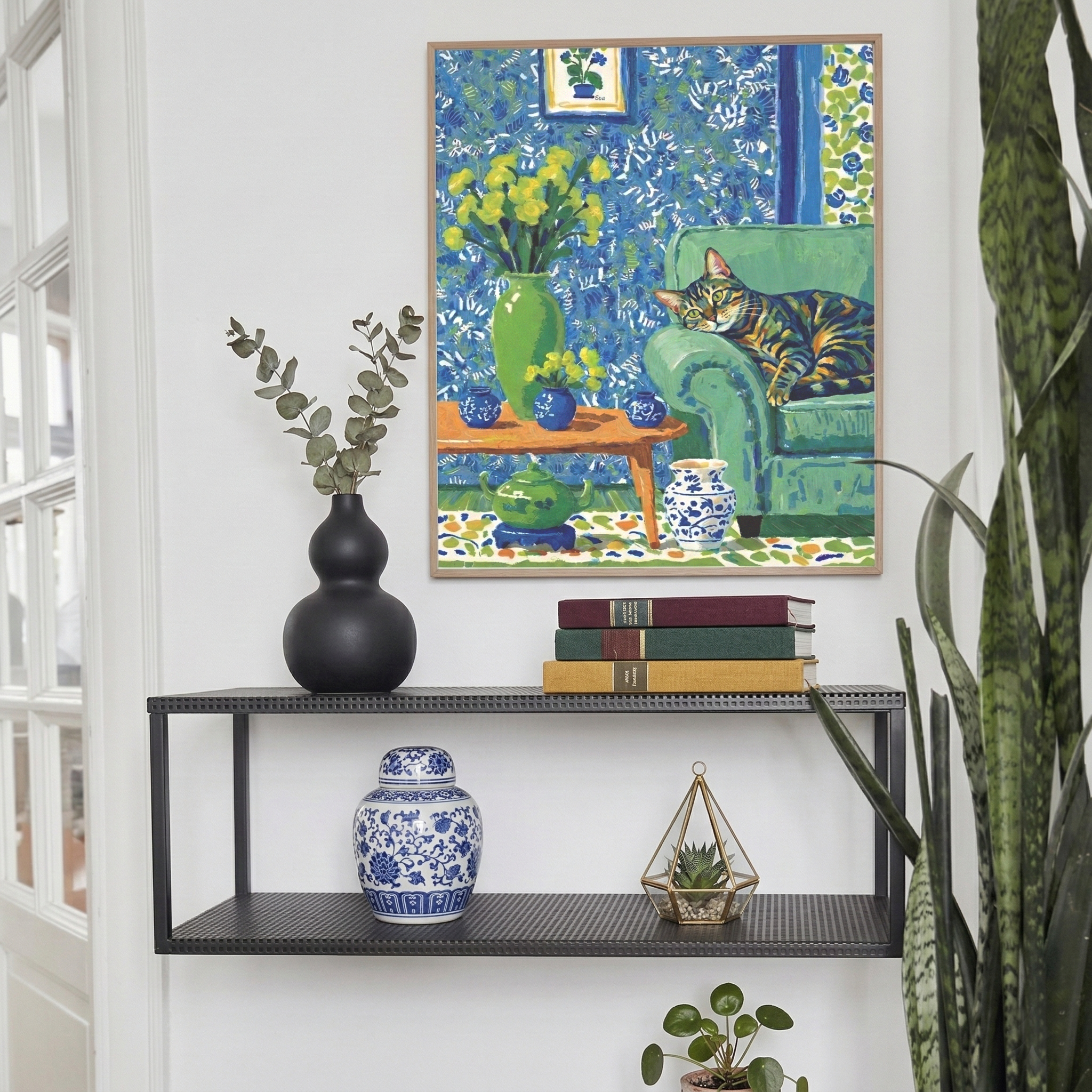 Impressionist pet portrait in blue and green tones displayed on a bookshelf